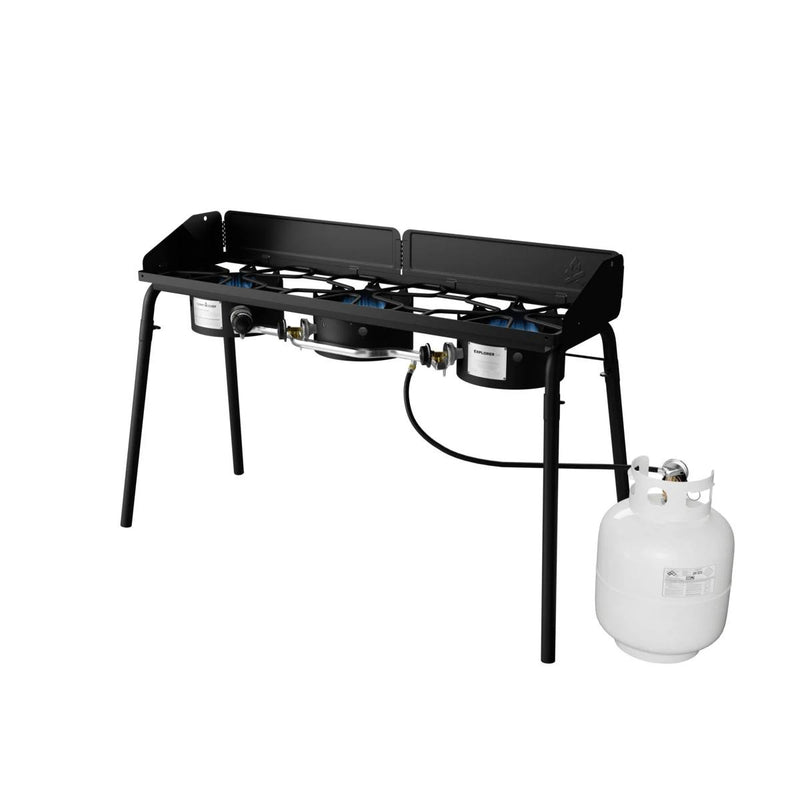 Load image into Gallery viewer, The Camp Chef Explorer is a black metal cooking system with two burners, four legs, control knobs, and a connected white propane tank—ideal for outdoor cooking or camping.