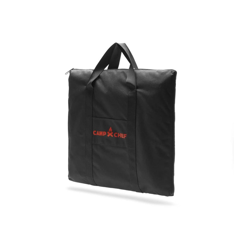 Load image into Gallery viewer, The Camp Chef Griddle Bag - 1 Burner is a black, weather-resistant square bag with two handles, a front pocket, and the red Camp Chef logo with fire icon—perfect for protecting your griddle. Photographed on a white background.
