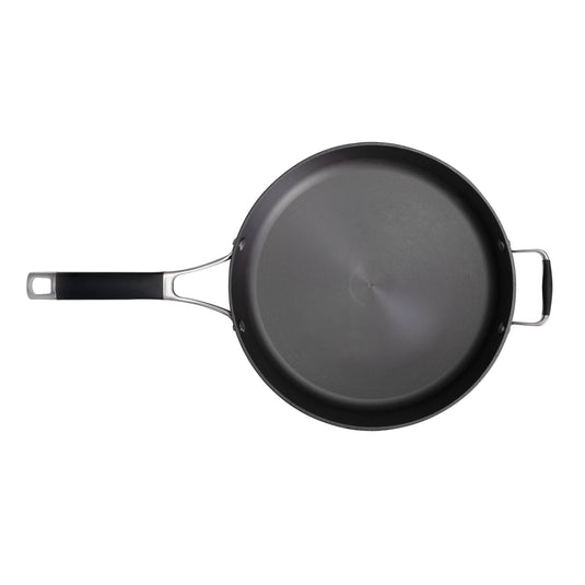 The Camp Chef Heritage Skillets is a black nonstick frying pan with excellent heat retention, a long handle, and a small helper handle opposite, seen from above on a white background.