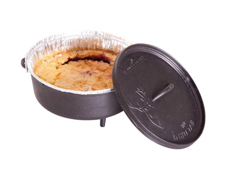 Load image into Gallery viewer, A Camp Chef Disposable Dutch Oven Liner with a baked pie inside sits in a three-legged Dutch oven. The lid is partially open, showing the pie and the liner—a classic Dutch oven cooking scene set against a white background.
