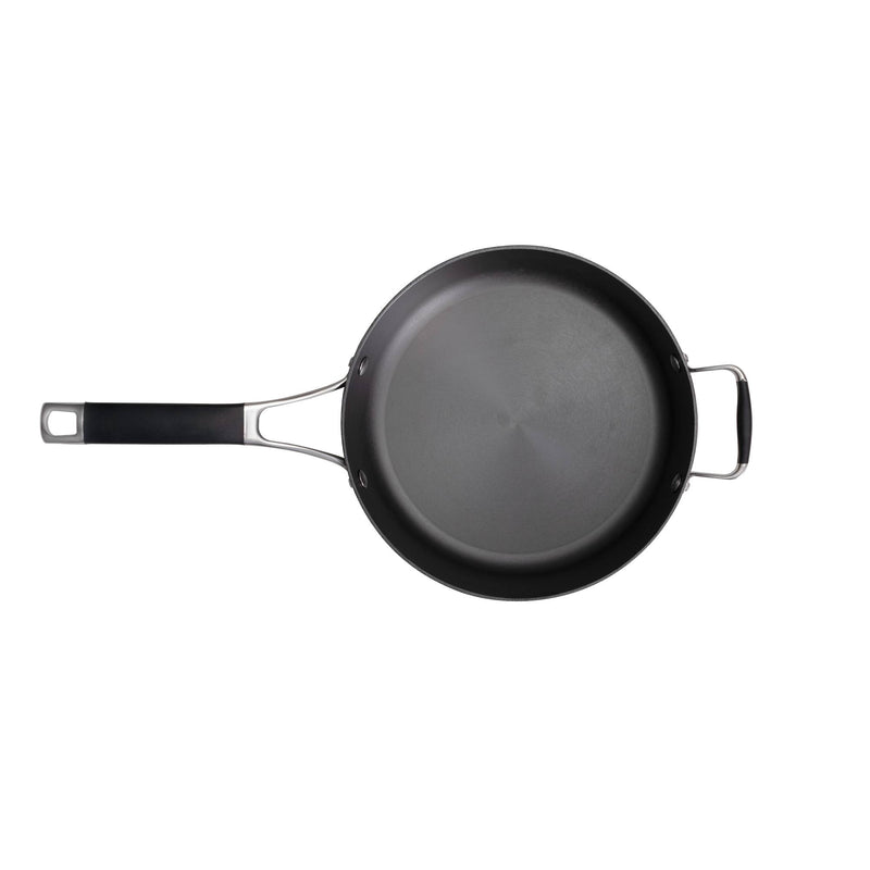 Load image into Gallery viewer, The Camp Chef Heritage Skillets is a black nonstick frying pan with excellent heat retention, a long handle on the left, and a small helper handle on the right, shown from above on a white background.
