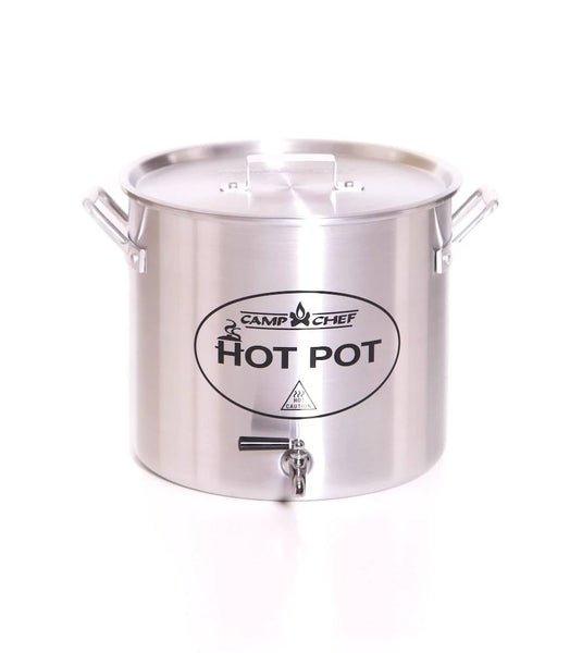The Camp Chef Hot Water Pot features stainless steel construction, a lid, side handles, and a front spout for easy pouring—perfect as an outdoor beverage dispenser for hot drinks at the campsite. Shown on a white background.