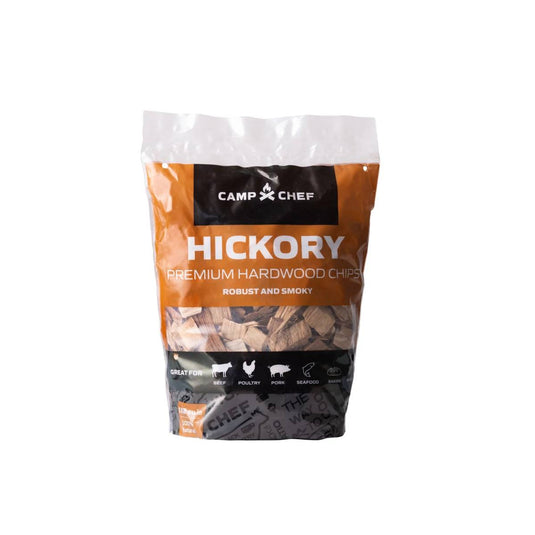 A bag of Camp Chef Wood Chips with orange and white packaging, labeled Robust and Smoky—ideal for adding smoky flavor to meats, poultry, pork, or seafood on the grill.