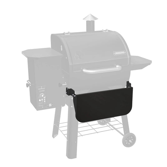 The Camp Chef Pellet Grill Front Shelf, shown in black and attached to the front of a Camp Chef pellet grill faded in the background, highlights this convenient accessory for your grill.