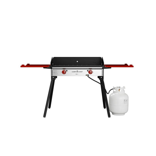 The Camp Chef PRO 14 is a portable outdoor gas grill with two red side shelves, black legs, and a connected white propane tank—ideal for versatile outdoor cooking—shown against a plain white background.