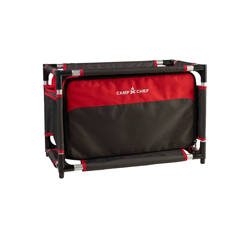 Load image into Gallery viewer, The Camp Chef Sherpa Table &amp; Organizer is a collapsible black and red camp table with a sturdy frame and fabric compartments, perfect as an outdoor cooking station or gear organizer on camping adventures.
