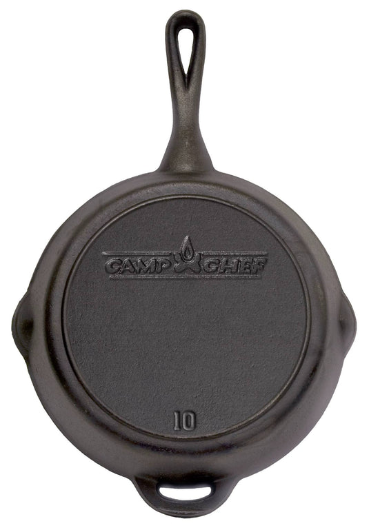 A Camp Chef Cast Iron Skillet is shown from above, featuring the brand name and number 10 on its base. The skillet includes a main handle at the top and an assist handle at the bottom.