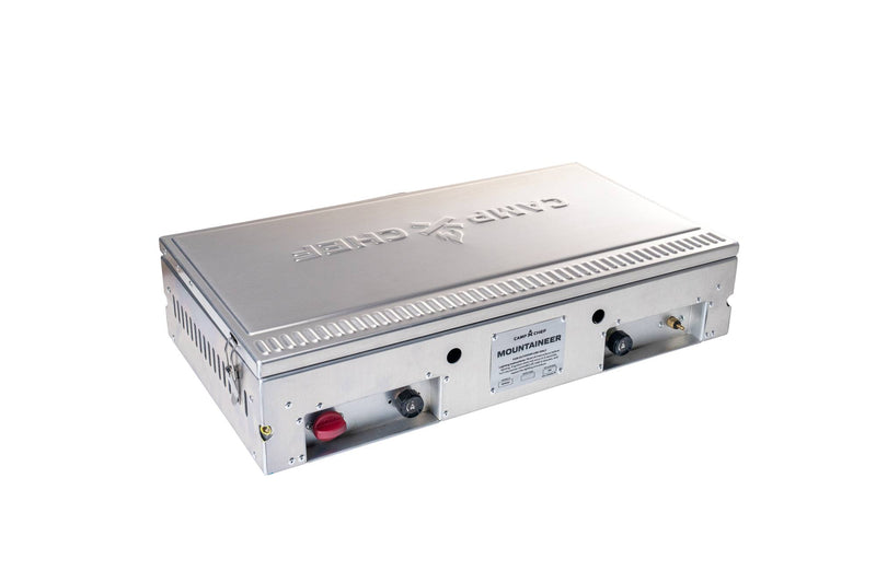 Load image into Gallery viewer, The Camp Chef Mountaineer is a durable rectangular metallic cooktop with two control knobs, side air vents, and the brand name engraved on the lid, shown resting on a white background.
