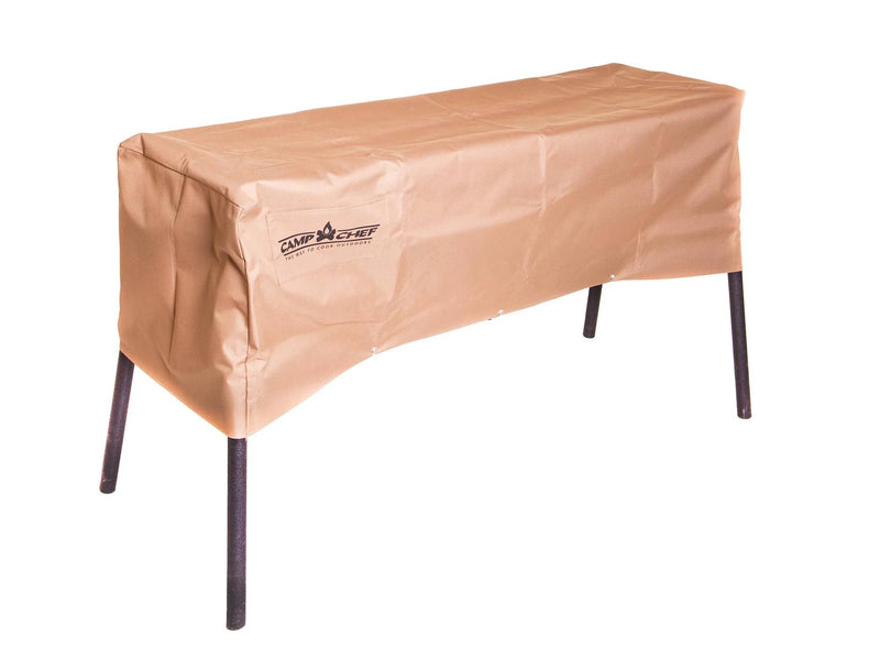 Load image into Gallery viewer, A rectangular Camp Chef 14 IN Stove Cover in tan, weather-resistant material protects an outdoor grill with four black metal legs, all set against a white background.
