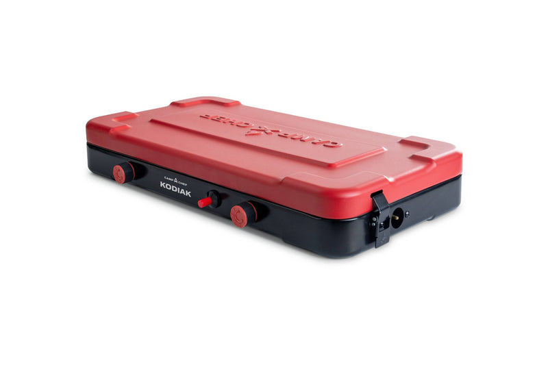 Load image into Gallery viewer, The Camp Chef Kodiak is a compact red and black portable camp stove with two burner knobs, offering reliable outdoor performance. Shown on a white background.

