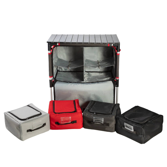 The Camp Chef Sherpa Table & Organizer features a portable black frame with shelves and gray fabric bins, plus four zippered storage cubes in gray, red, black, and dark gray—perfect for use as an outdoor cooking station or camp table.