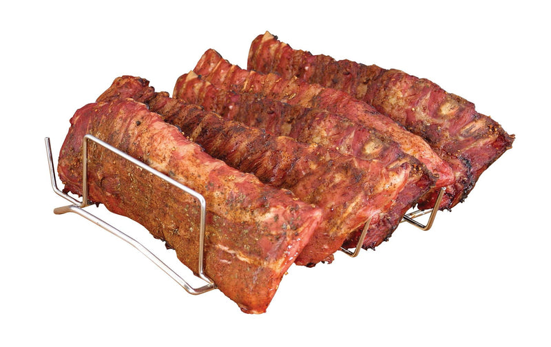 Load image into Gallery viewer, Three racks of seasoned, smoked pork ribs rest on the Camp Chef Rib Rack, isolated on a white background. The ribs look roasted in a smoker, featuring a slightly charred and crispy exterior.
