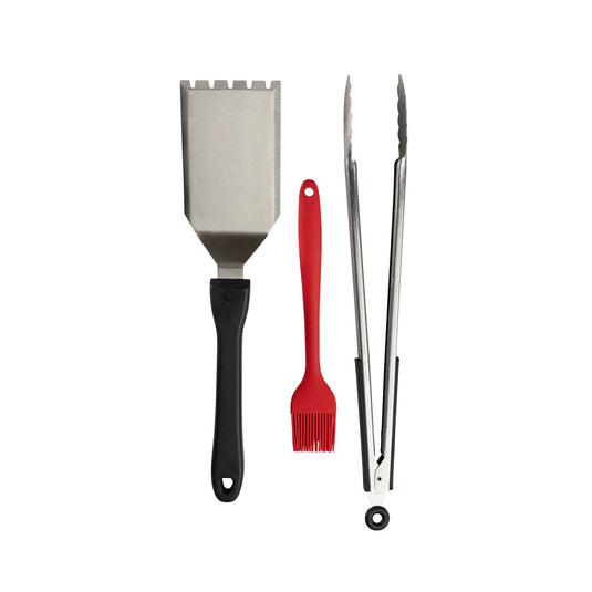 The Camp Chef BBQ Tool Set includes a metal spatula with a black handle, red silicone basting brush, and metal tongs with black grips—essential barbecue accessories for any grill master. All items are displayed side by side on a white background.