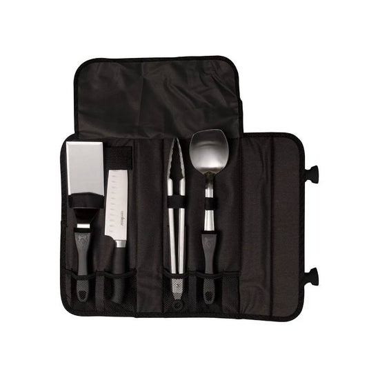 The Camp Chef 5 Piece All Purpose Chef Set features a black roll-up case with four stainless steel utensils—spatula, knife, tongs, and spoon—each with a black handle in its own slot. Ideal for grilling or camp cooking.