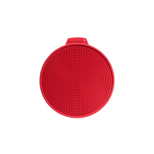 A Camp Chef Silicone Hot Pad, round and red with a textured, raised dot surface and a small top tab, ideal for use under hot pans.