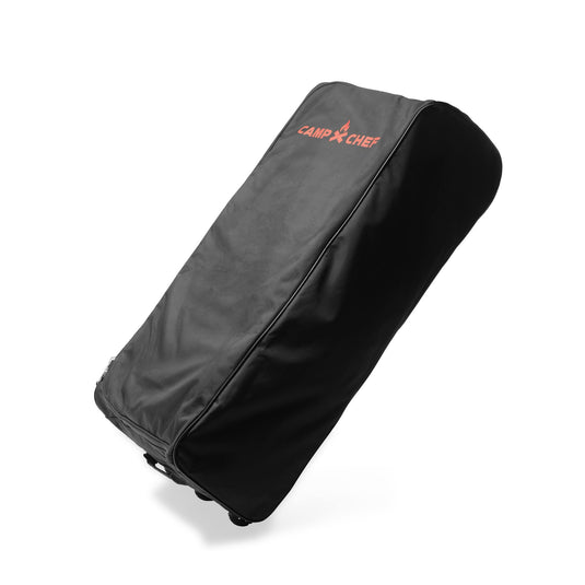 The Camp Chef Stove System Roller Bag is a heavy-duty black carry bag with red text, perfect for transporting your 2-burner grill.