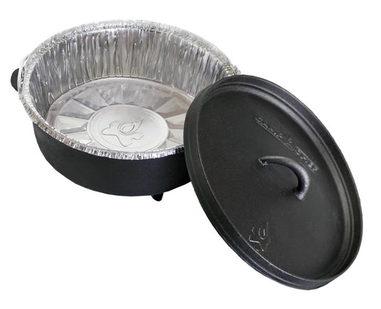 A black cast iron Dutch oven is shown with a Camp Chef Disposable Dutch Oven Liner inside and the lid nearby, making cleanup easy after deep Dutch oven cooking.