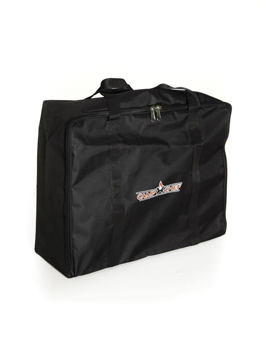 The Camp Chef Accessory Carry Bag - 16 x 24 is a large black, water-resistant bag with handles and the Camp Chef logo on the front, shown standing upright against a white background.