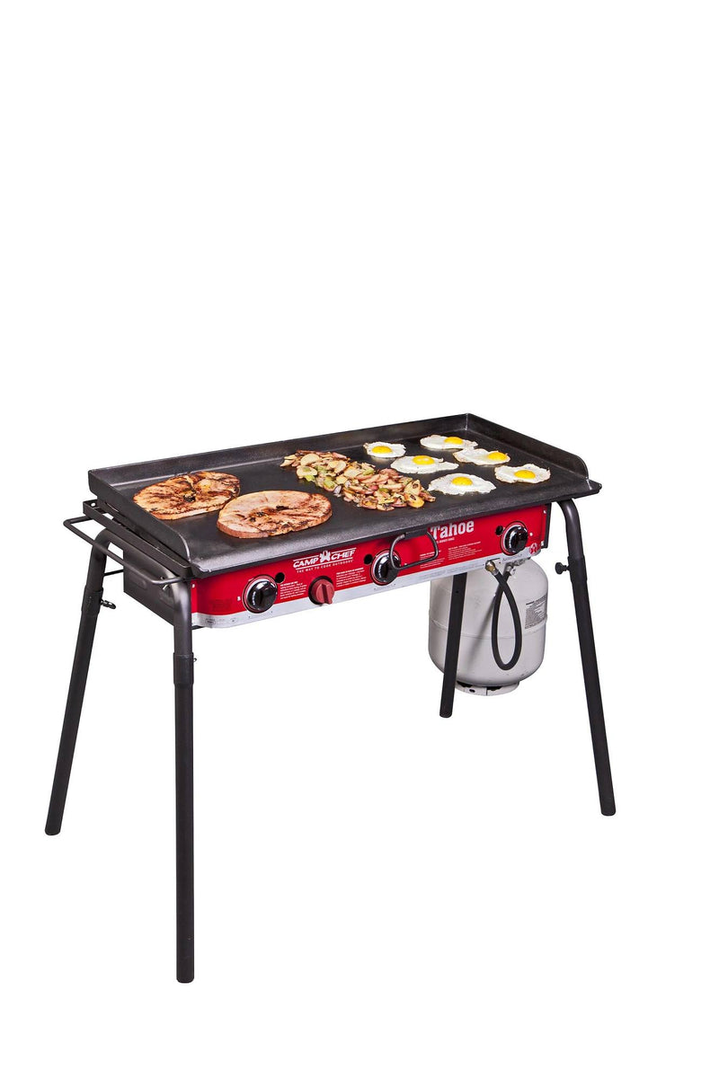 Load image into Gallery viewer, The Camp Chef Griddles 16 is a red and black four-burner flat top griddle, perfect for cooking pancakes, eggs, and hash browns. It features an attached propane tank and is shown against a white background.

