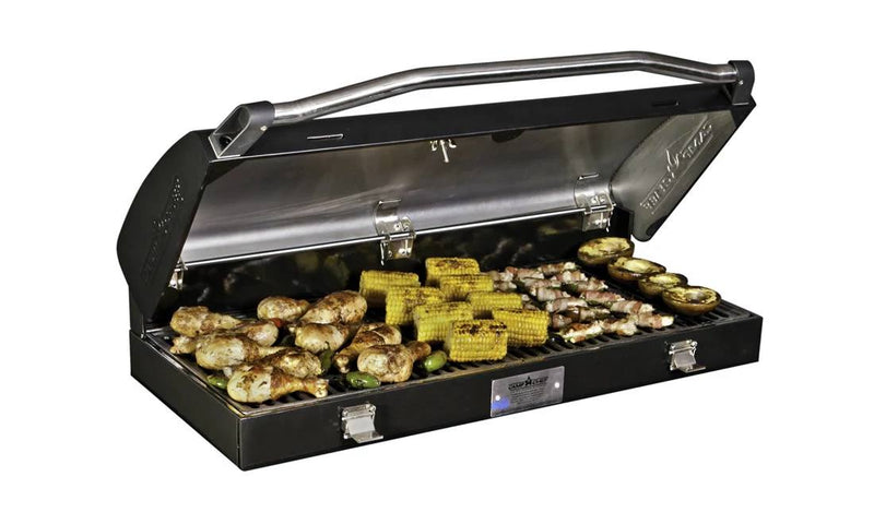 Load image into Gallery viewer, The Camp Chef BBQ Grill Box 14 - 2 Burner, with its cast iron grate and open lid, cooks chicken drumsticks, corn on the cob, bacon-wrapped treats, eggplant slices, and veggies to perfection.
