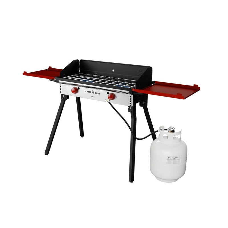 Load image into Gallery viewer, The Camp Chef PRO 14 is a portable outdoor gas grill with two red side shelves, two control knobs, black sturdy legs, and a white propane tank—ideal for outdoor cooking and part of the Camp Chef PRO 14 system.
