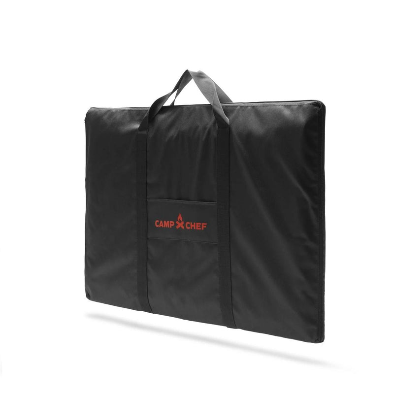 Load image into Gallery viewer, The Camp Chef Griddle Bag 16 - 2 Burner is a black rectangular padded case with handles, a front pocket, and the red Camp Chef logo. It's weather-resistant and ideal for carrying your griddle or other portable outdoor gear.
