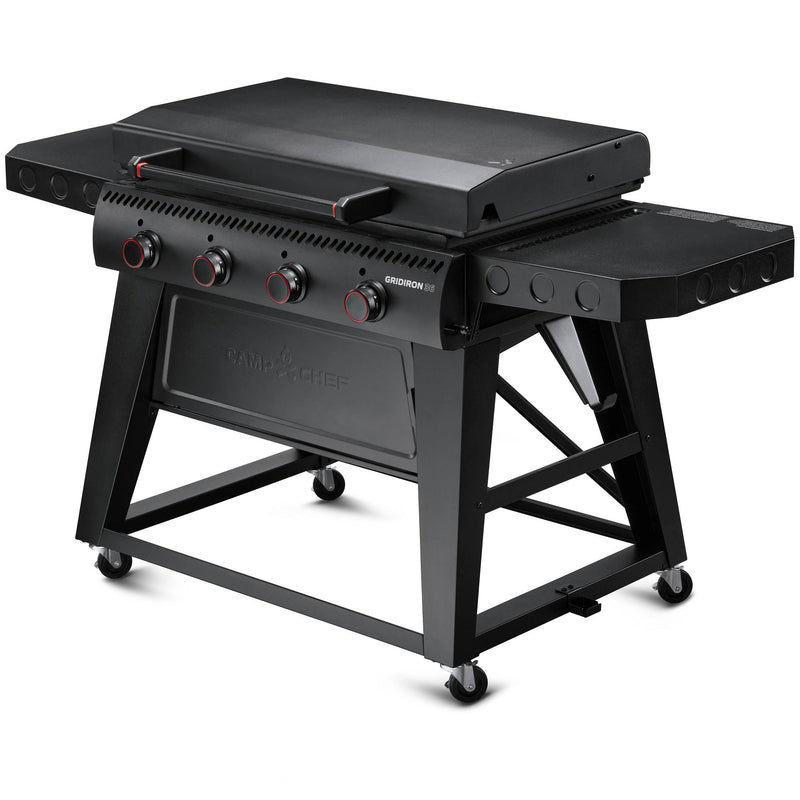 Load image into Gallery viewer, The Camp Chef Gridiron 36 is a black outdoor gas grill featuring four control knobs, a flat griddle surface for even heating, side shelves, wheels for mobility, and a closed lid—all in a sturdy, modern design for easy clean-up.
