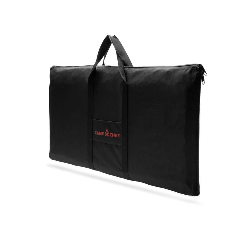 Load image into Gallery viewer, The Camp Chef Griddle Bag 16 - 3 Burner is a black, rectangular carry bag with two handles, a small front pocket featuring the red Camp Chef logo, and a zippered design with a weather-resistant liner. Shown on a white background.
